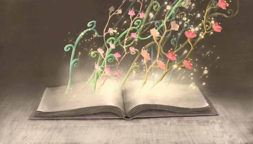 開いた本のページから、ピンク色と赤色の花が咲いたつる植物が光とともに魔法のように湧き出ている、創造性と知識の成長を表現したイラスト。